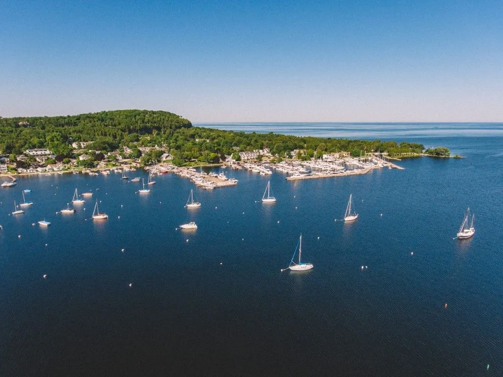 A sailboat gliding across the water in Door County